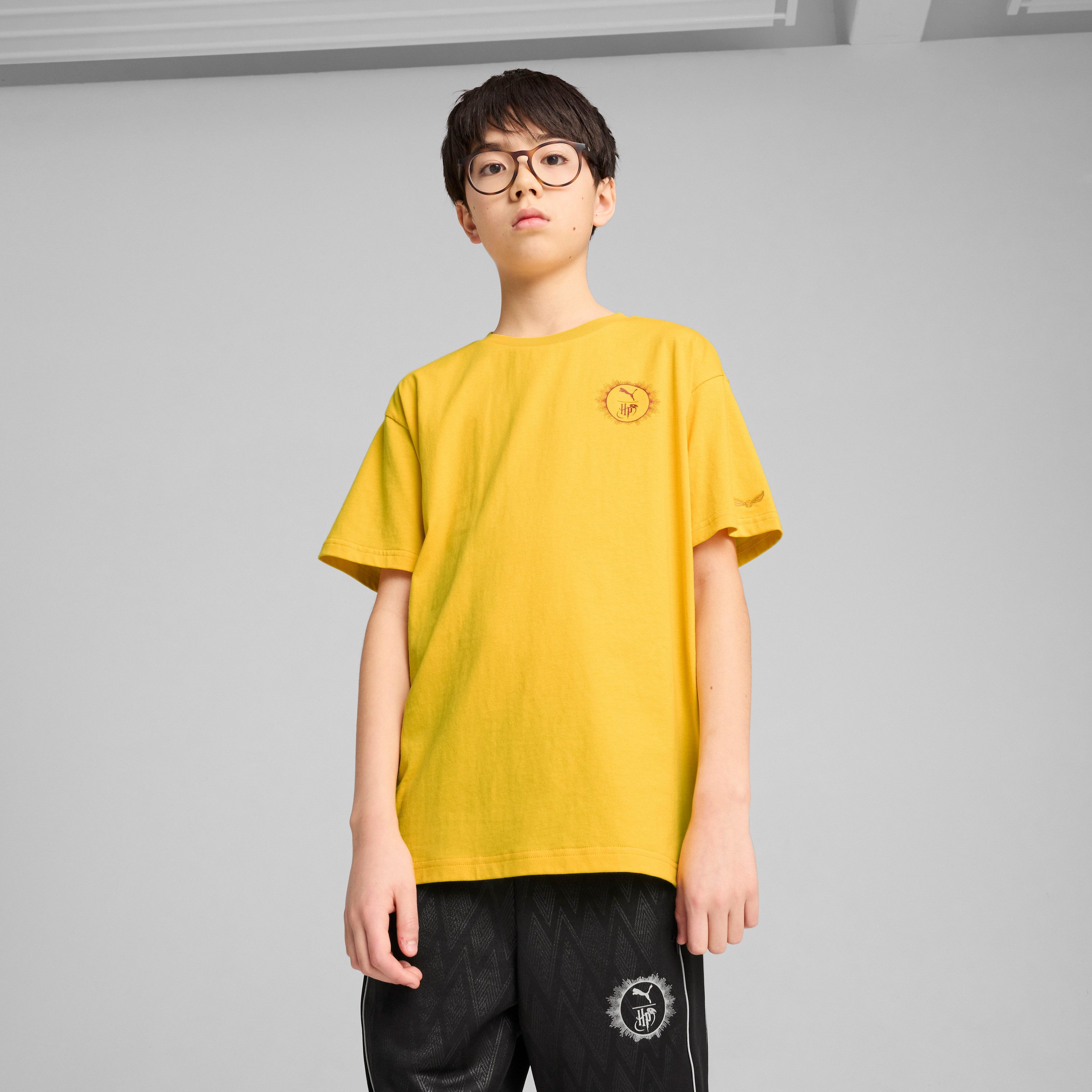 PUMA T-shirt X HARRY POTTER RELAXED GRAPHIC TEE jongens t-shirts maat 140 geel