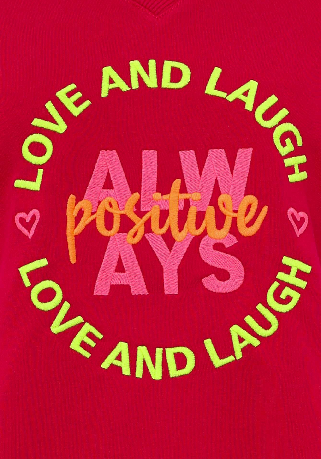 Zwillingsherz Sweatshirt met neonkleurig "always positive"-borduursel in vokuhila-snit