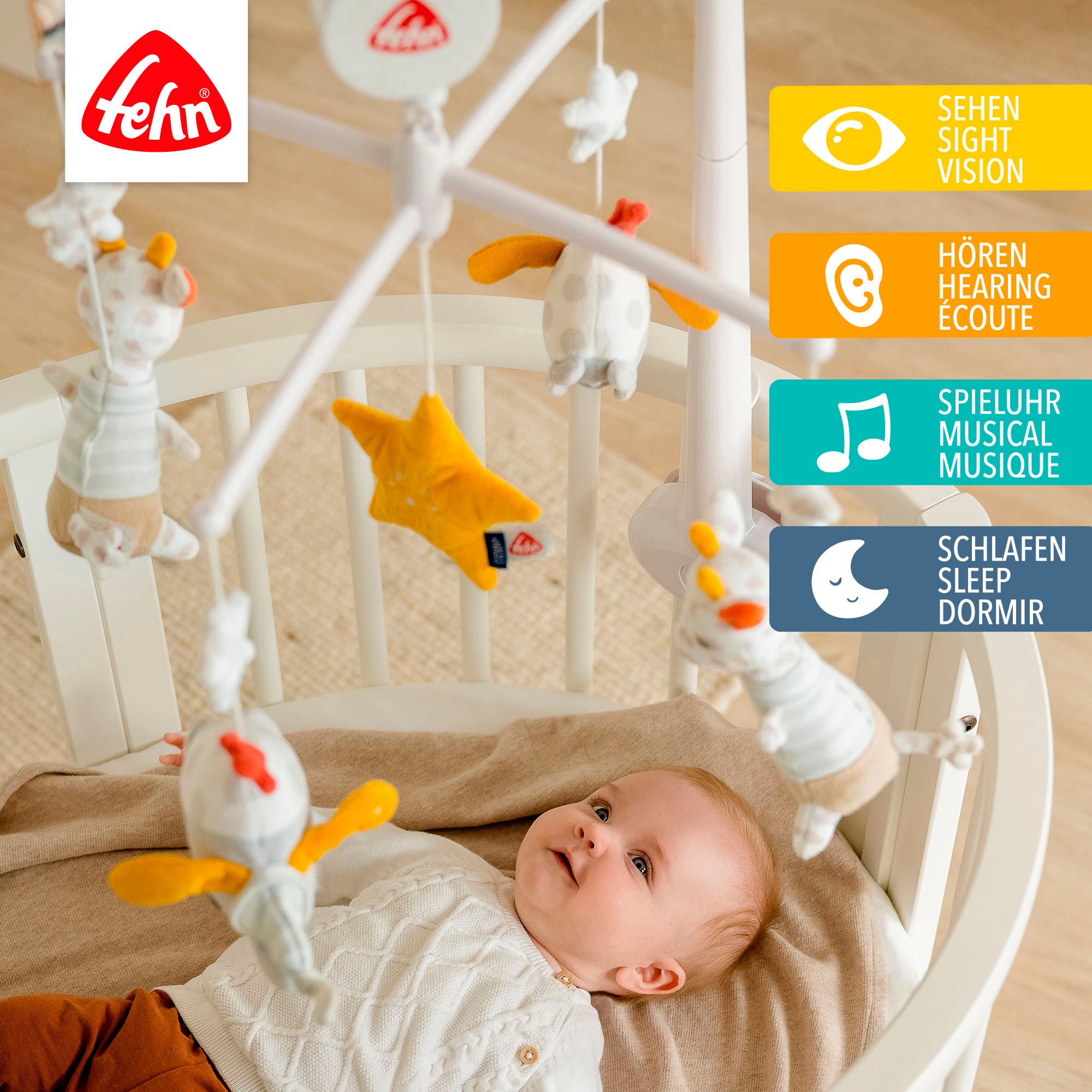 Fehn Mobiel Welterusten met speeldoosje en glow-in-the-dark-borduursel