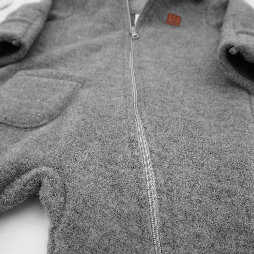 MAXIMO Fleece-jumpsuit met puntcapuchon met pompon en rits