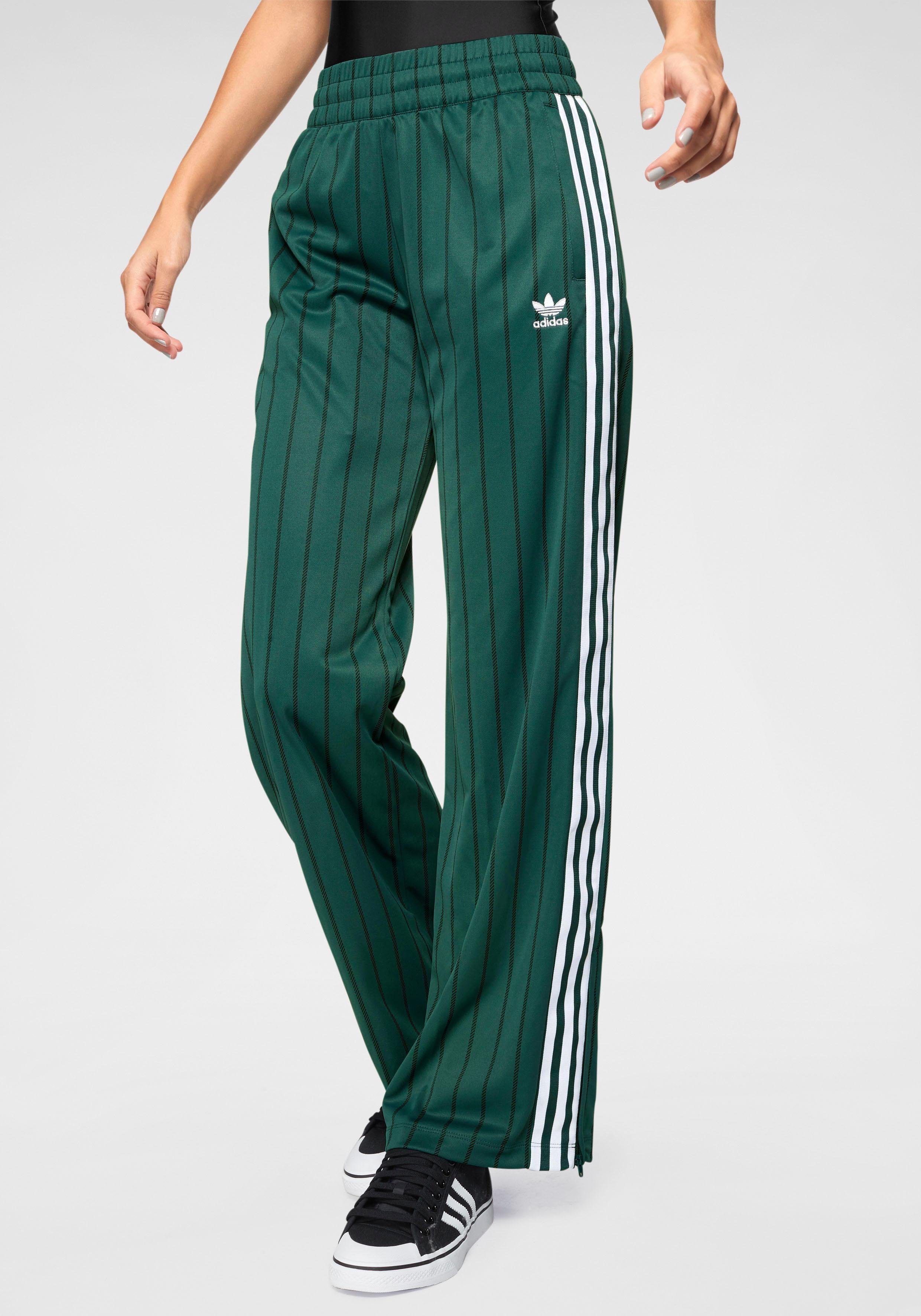 Адидас зеленый спортивный. Брюки track Pant adidas. Adidas Originals штаны широкие. Adidas SST track Pants. Широкие штаны adidas NANOTEX.