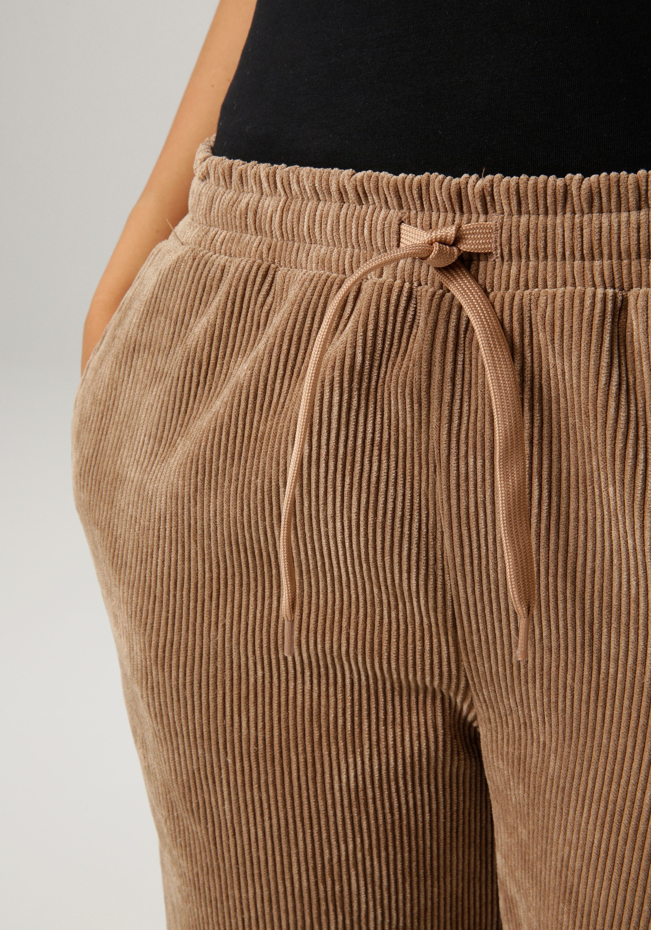 Aniston CASUAL Comfortbroek van trendy, elastische cord