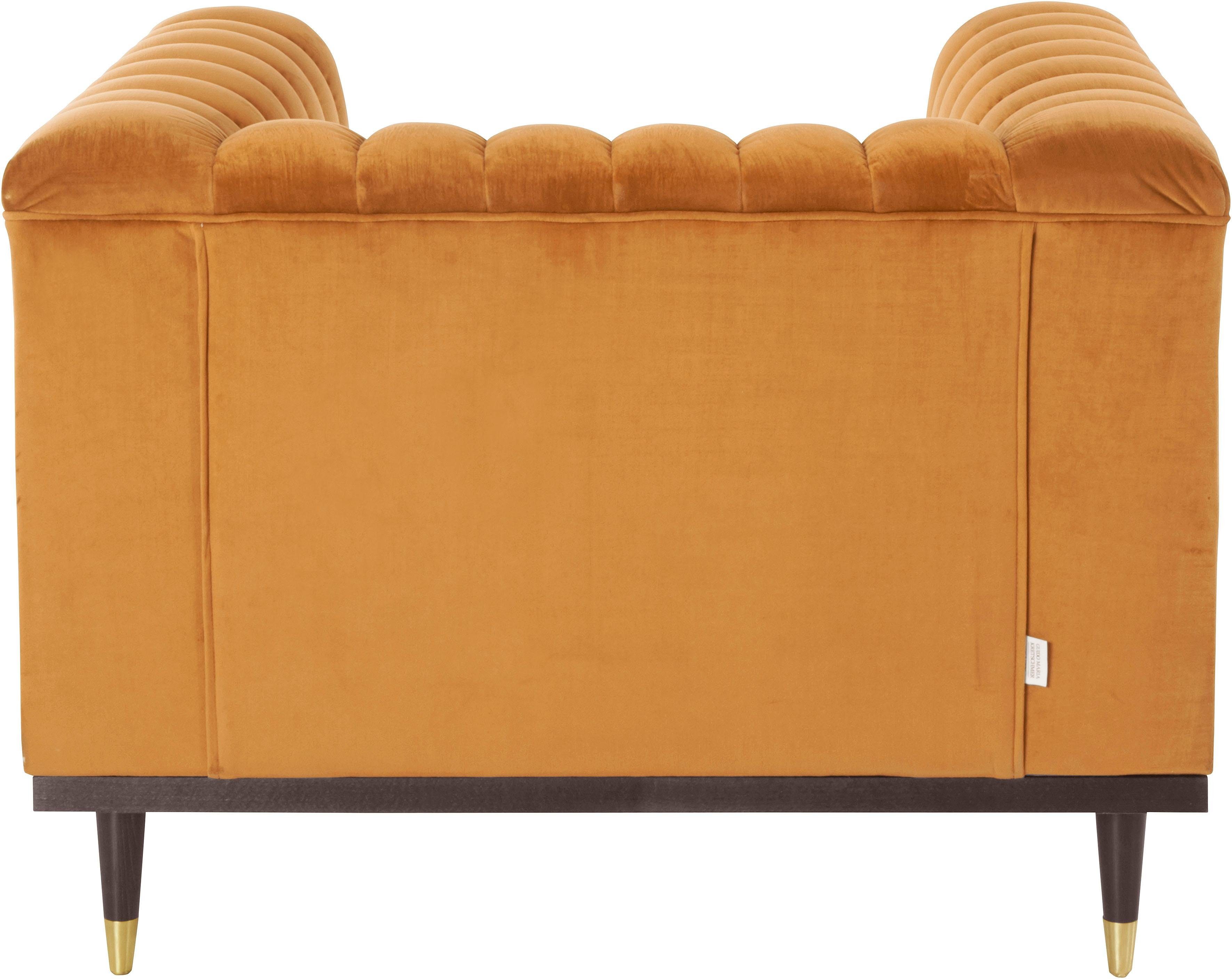 Guido Maria Kretschmer Home&Living Fauteuil Chamby met houten rand onder en stiksels bij de leuning