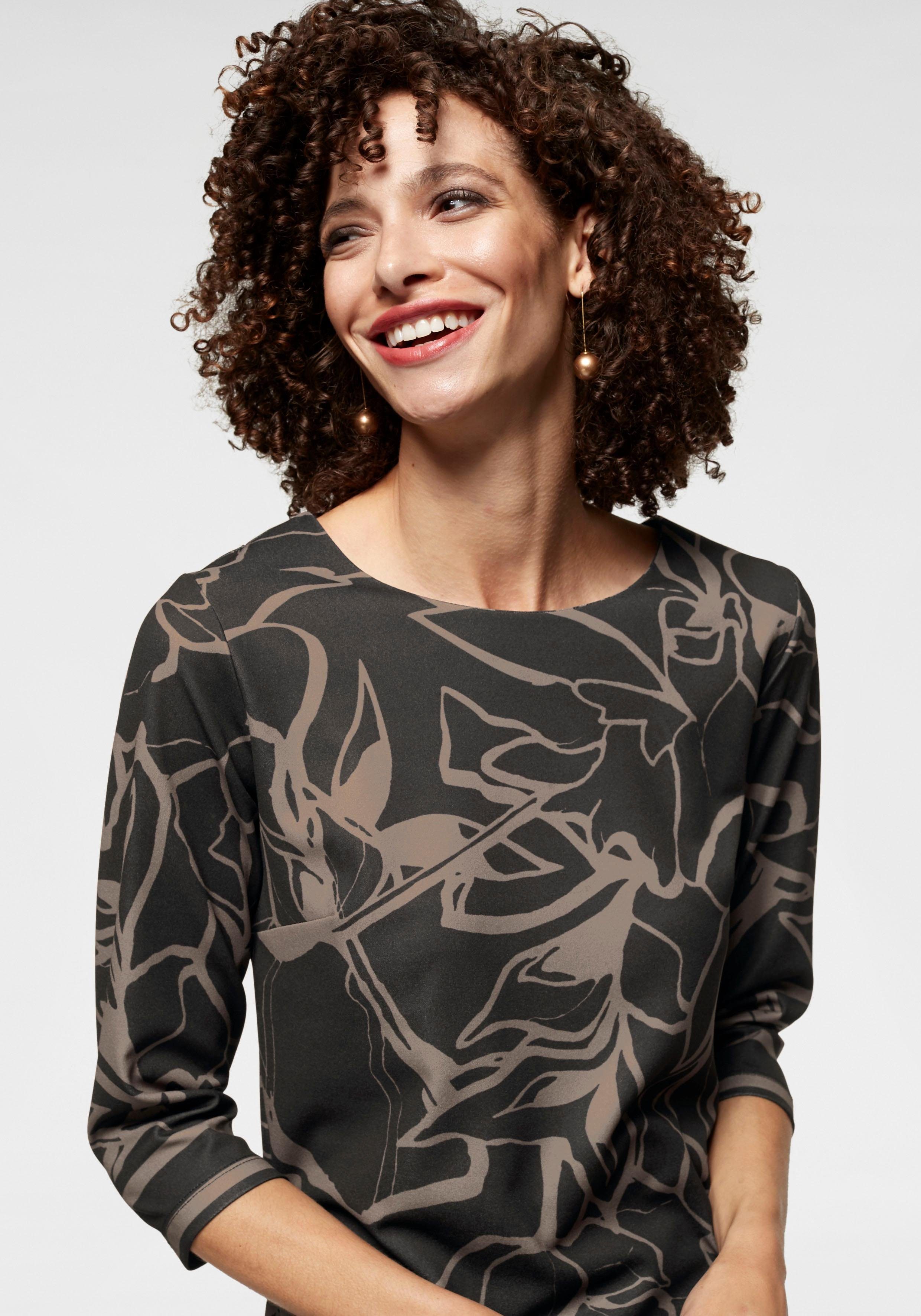 Aniston SELECTED Jerseyjurk met interessante print all-over