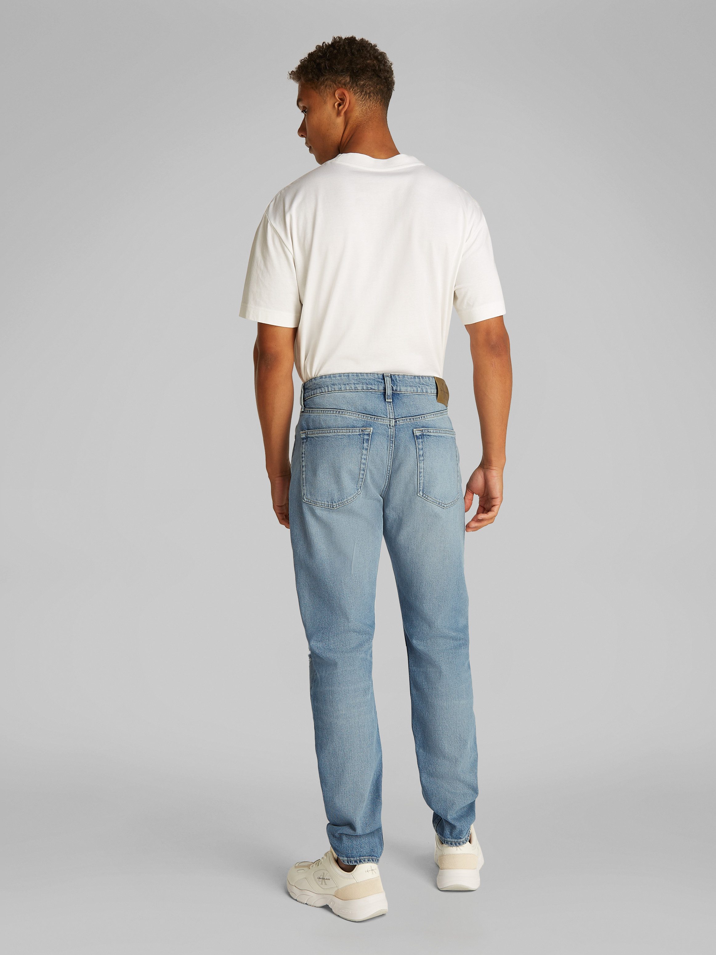 Calvin Klein Destroyed jeans SLIM TAPER in lichtblauwe wassing