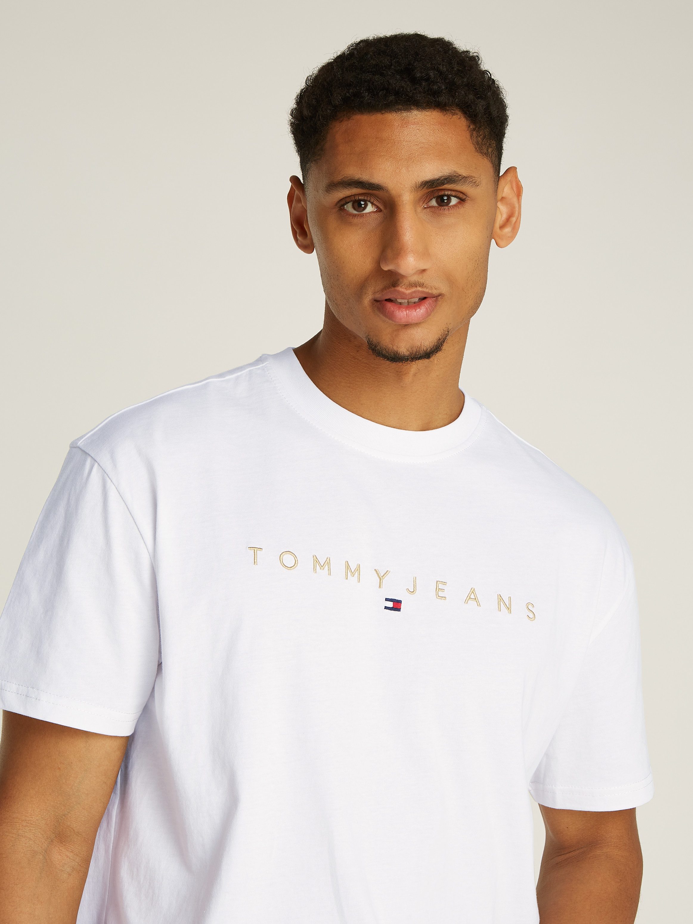 TOMMY JEANS T-shirt TJM REG GOLD LINEAR LOGO TEE EXT