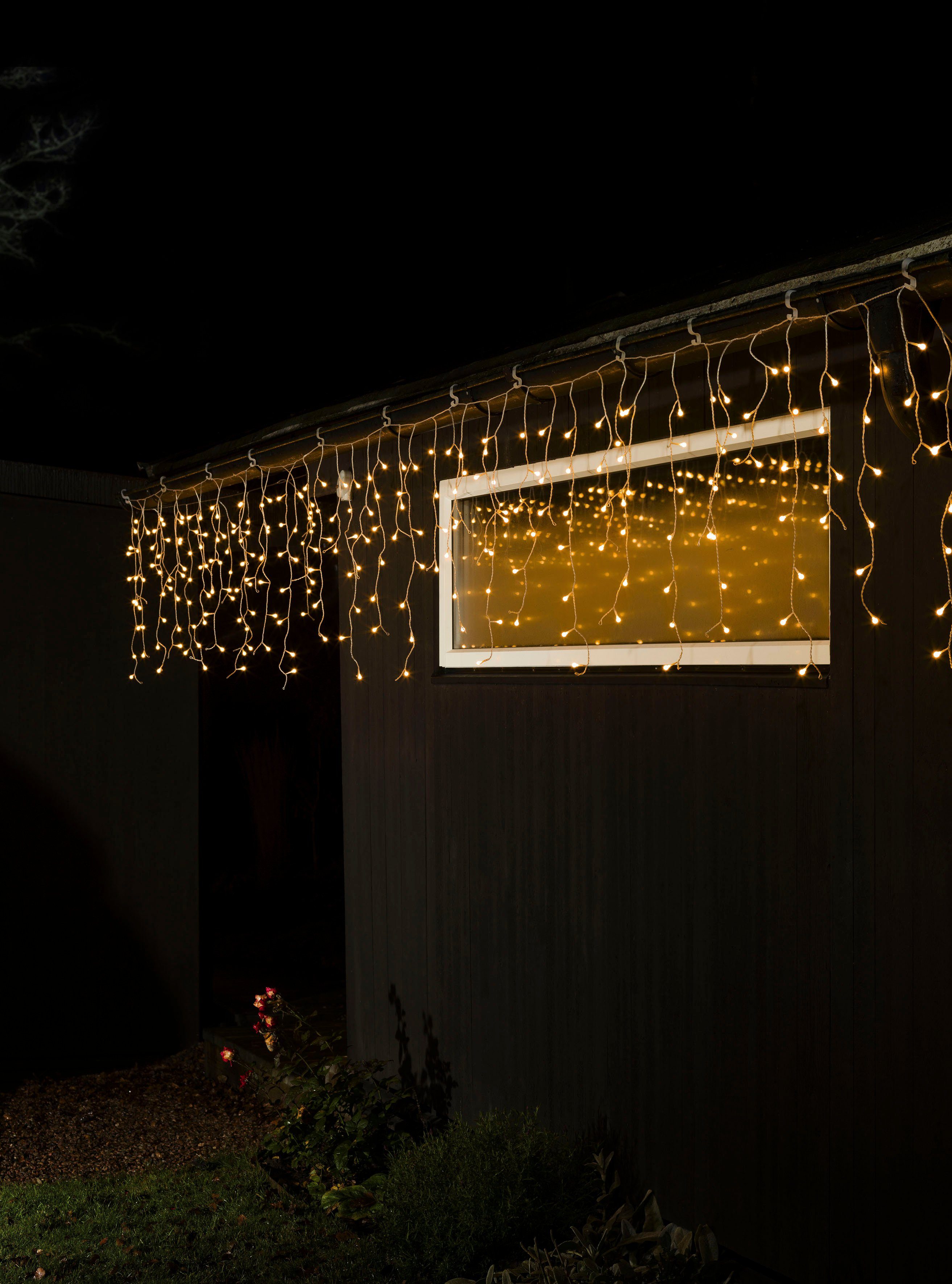 KONSTSMIDE Led-lichtgordijn LED solar ijsregenlicht gordijn, 200 amberkleurige diodes, timer Afstandsbediening dimbaar, 8 lichtfuncties, zonnebox oplaadbaar via USB (2 stuks)