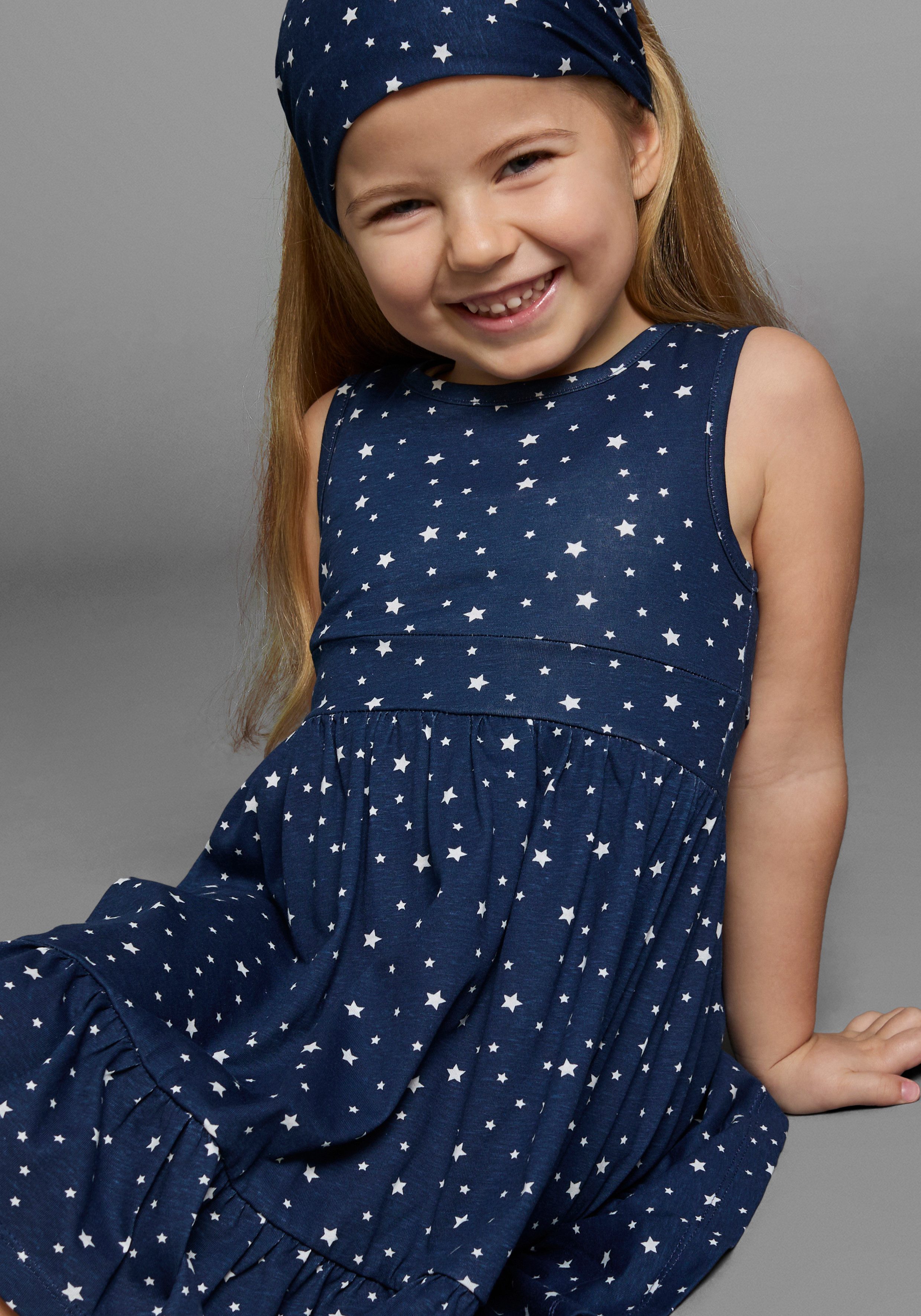 KIDSWORLD Jerseyjurk 2-delig shirtjurk + haarband in schattig sterren-allover feestelijke gelegenheden, knie-lange, speelse stijl, van katoen (set, 2-delig)