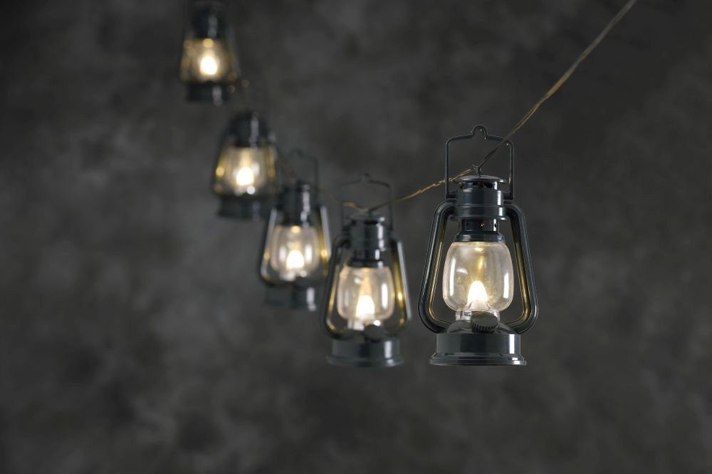 KONSTSMIDE Led-lichtsnoer 8 groene stormlantaarns, 8 warmwitte diodes