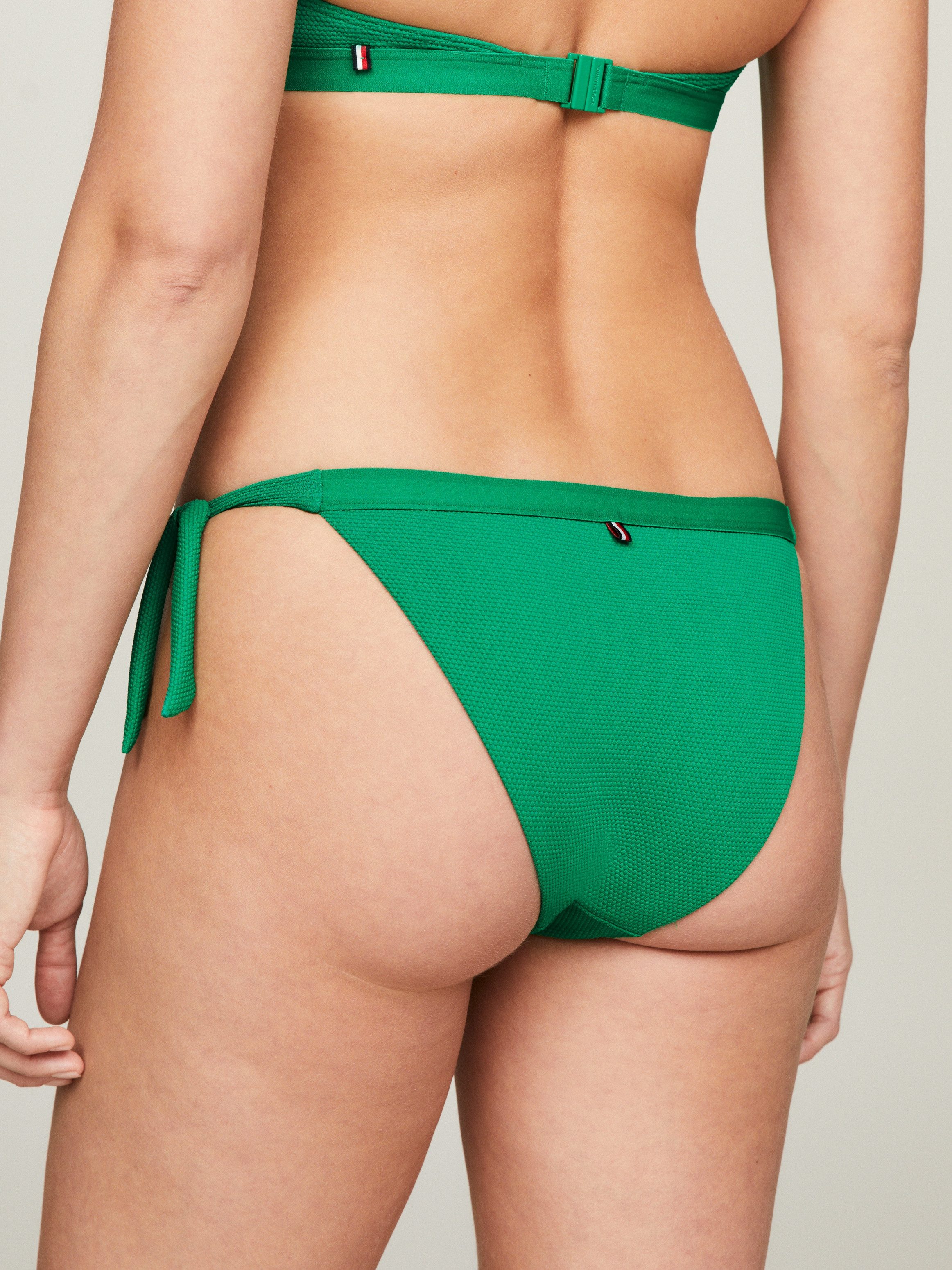 Tommy Hilfiger Swimwear Bikinibroekje SIDE TIE BIKINI met een logo-opschrift