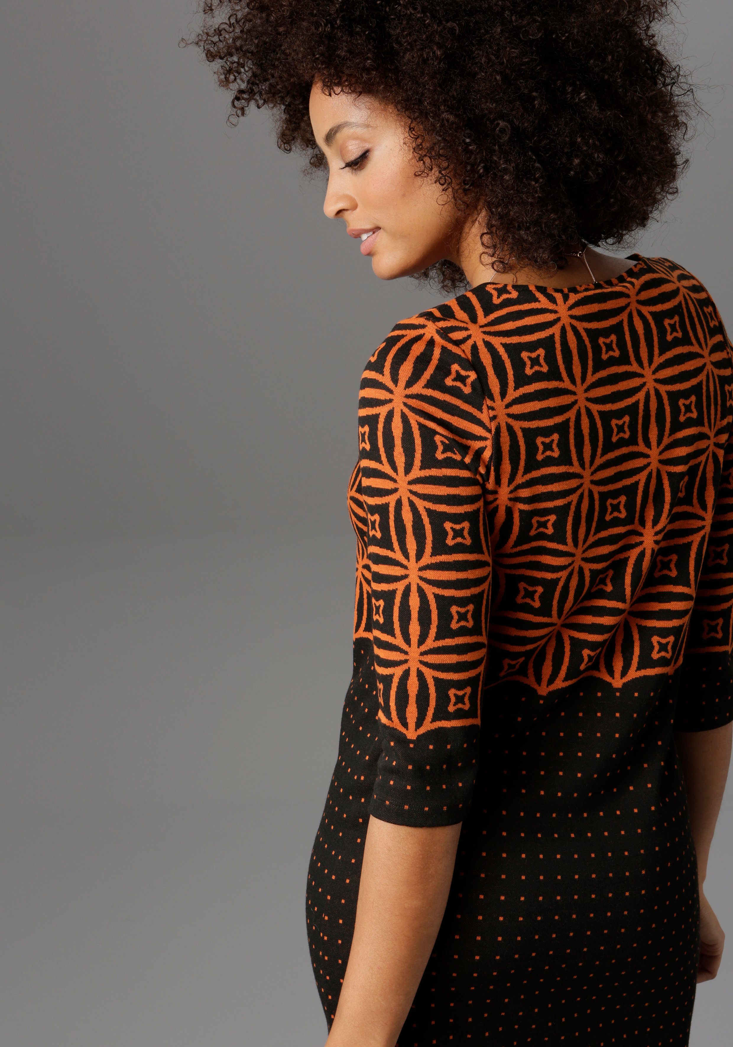 Aniston SELECTED Jerseyjurk met modern motief- en stippendesign