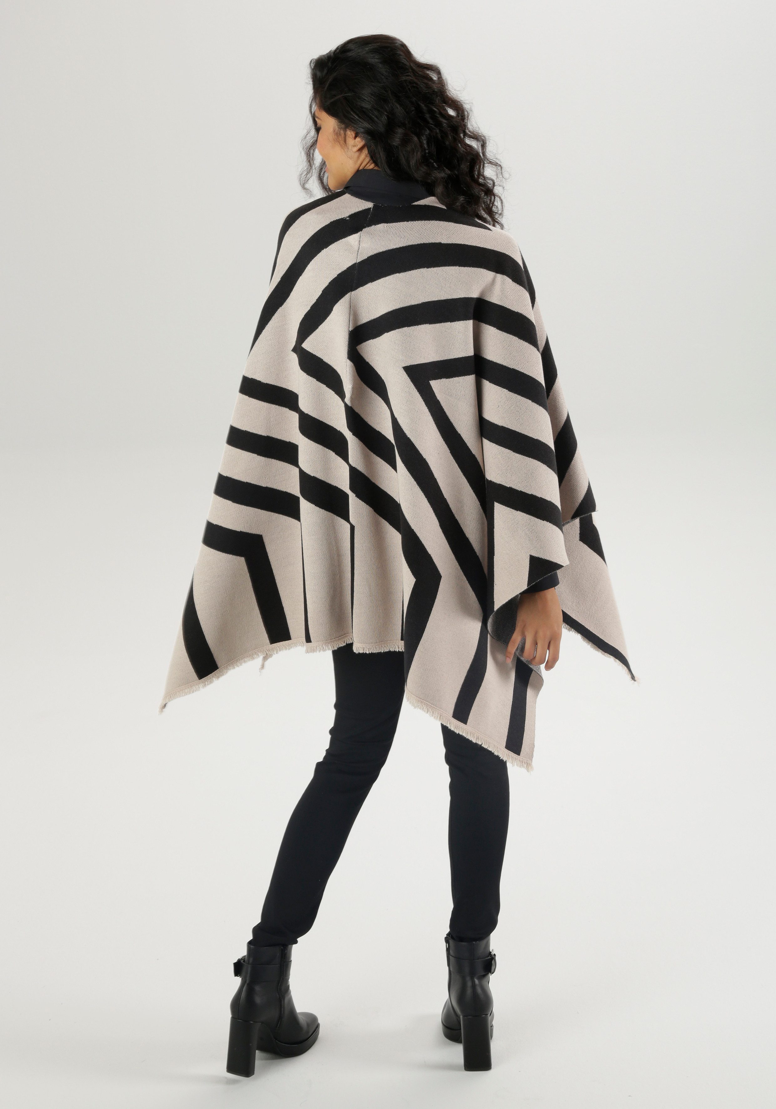 Aniston SELECTED Gebreide poncho sjaal met franjes en grafisch patroon