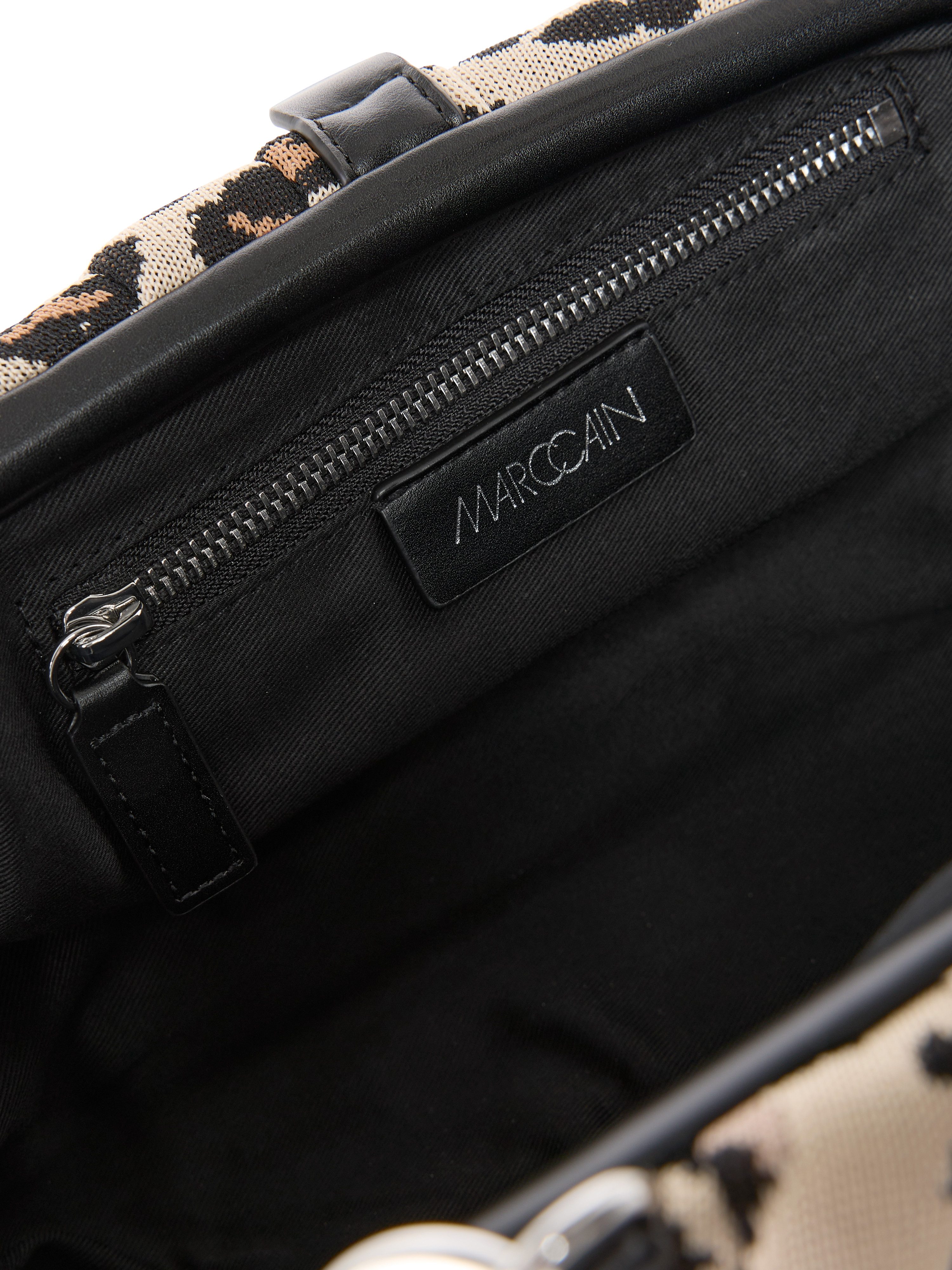 Marc Cain Clutch Collections Feminine Rigour