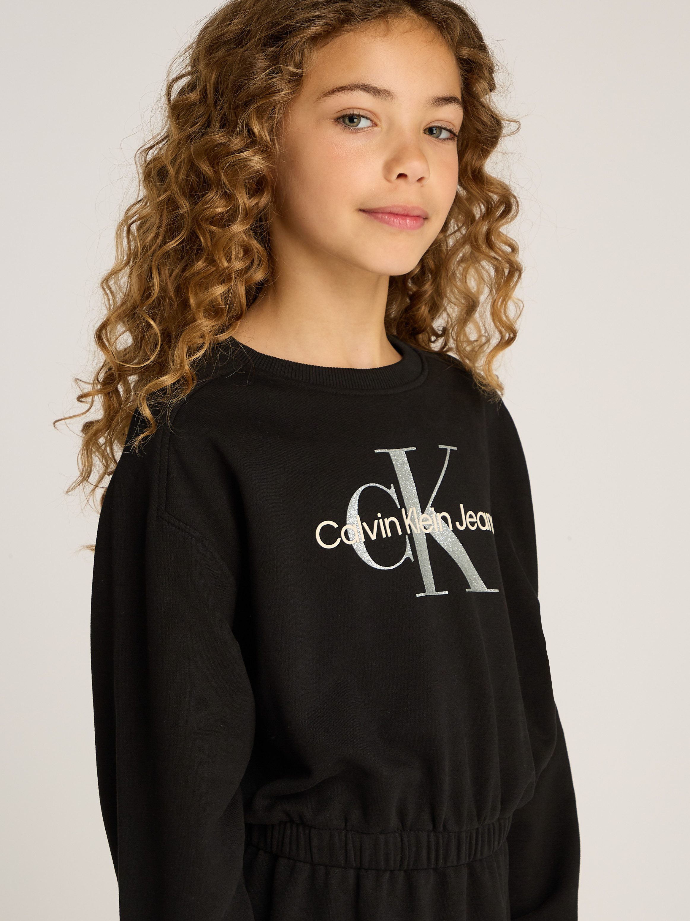 Calvin Klein Sweatjurk GLITTER MONOLOGO HWK DRESS voor kinderen tot 16 jaar met logo-opdruk