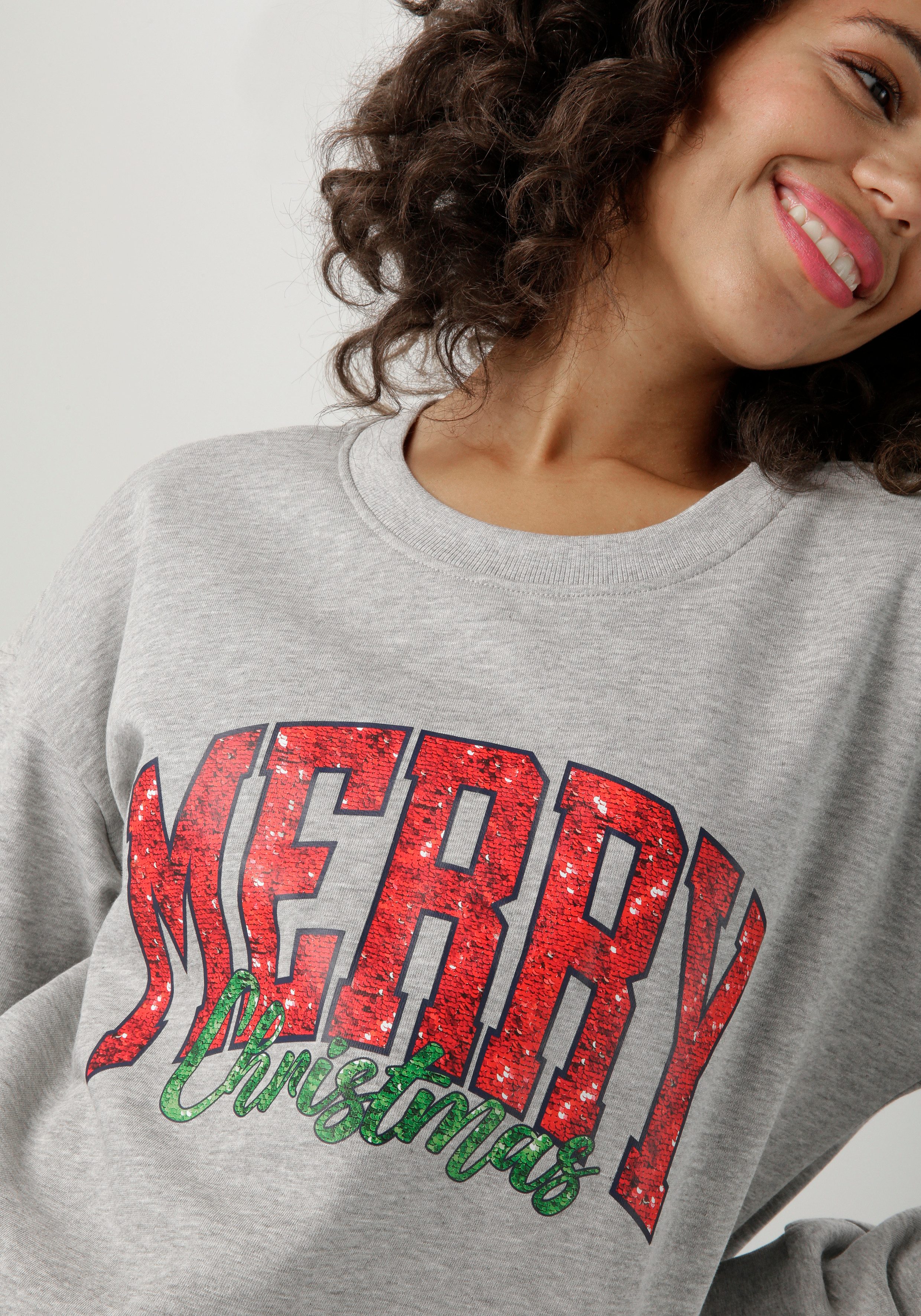 Aniston CASUAL Kerst-sweatshirt met "merry christmas"-opschrift in pailletten-look - nieuwe collectie
