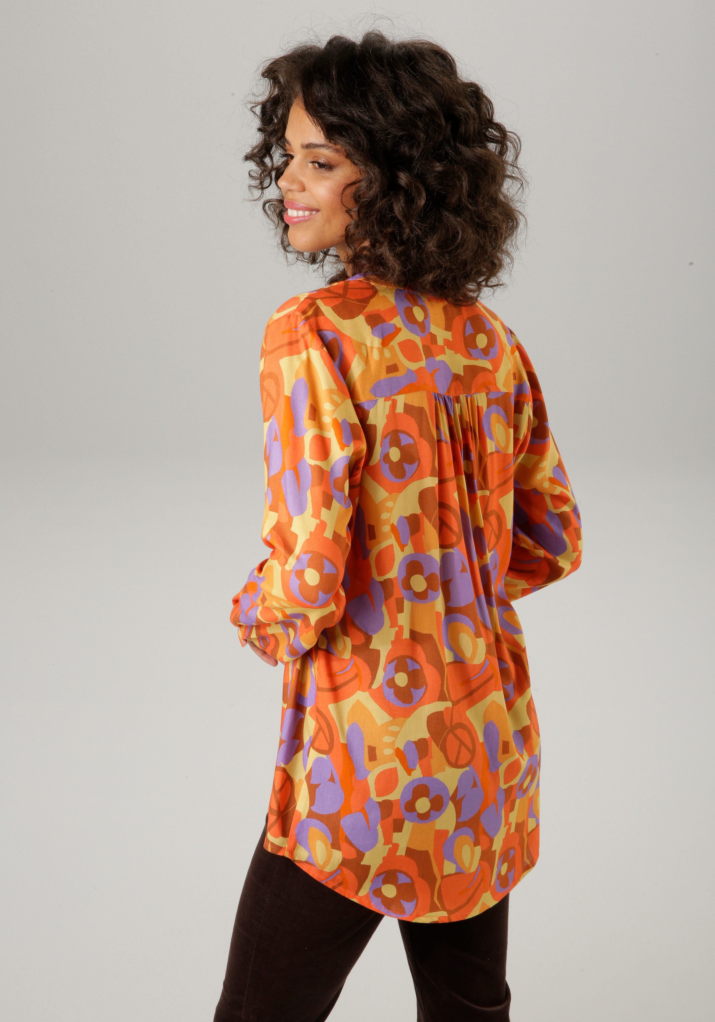 Aniston CASUAL Blouse zonder sluiting met extravagante, grafische print