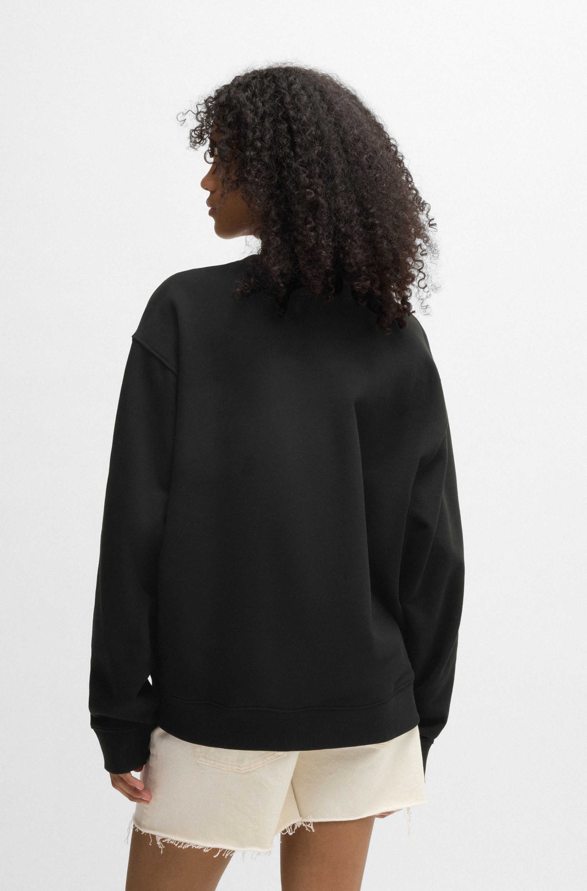 HUGO Blue Sweatshirt Oversized crew met bloemenprint op de achterkant, straß logo print