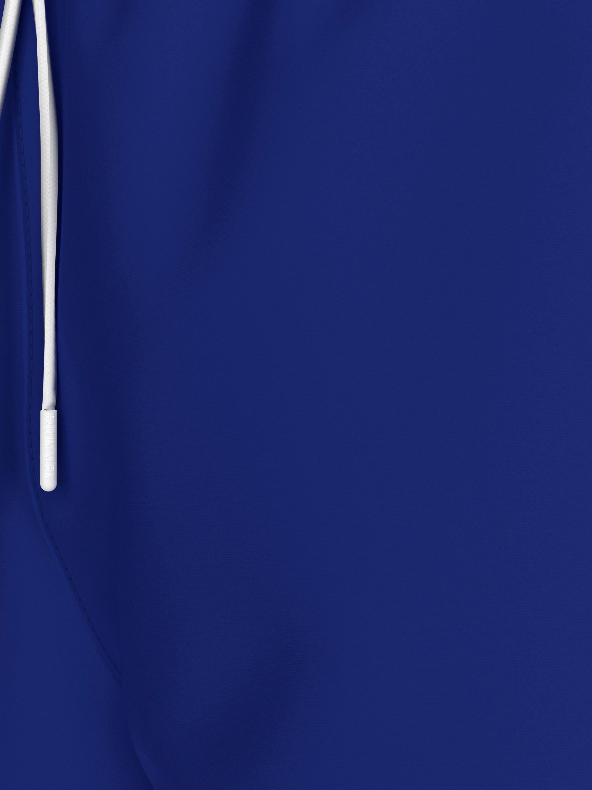 Calvin Klein Swimwear Zwemshort MEDIUM DRAWSTRING met contrasterende logo-opdruk op de pijp