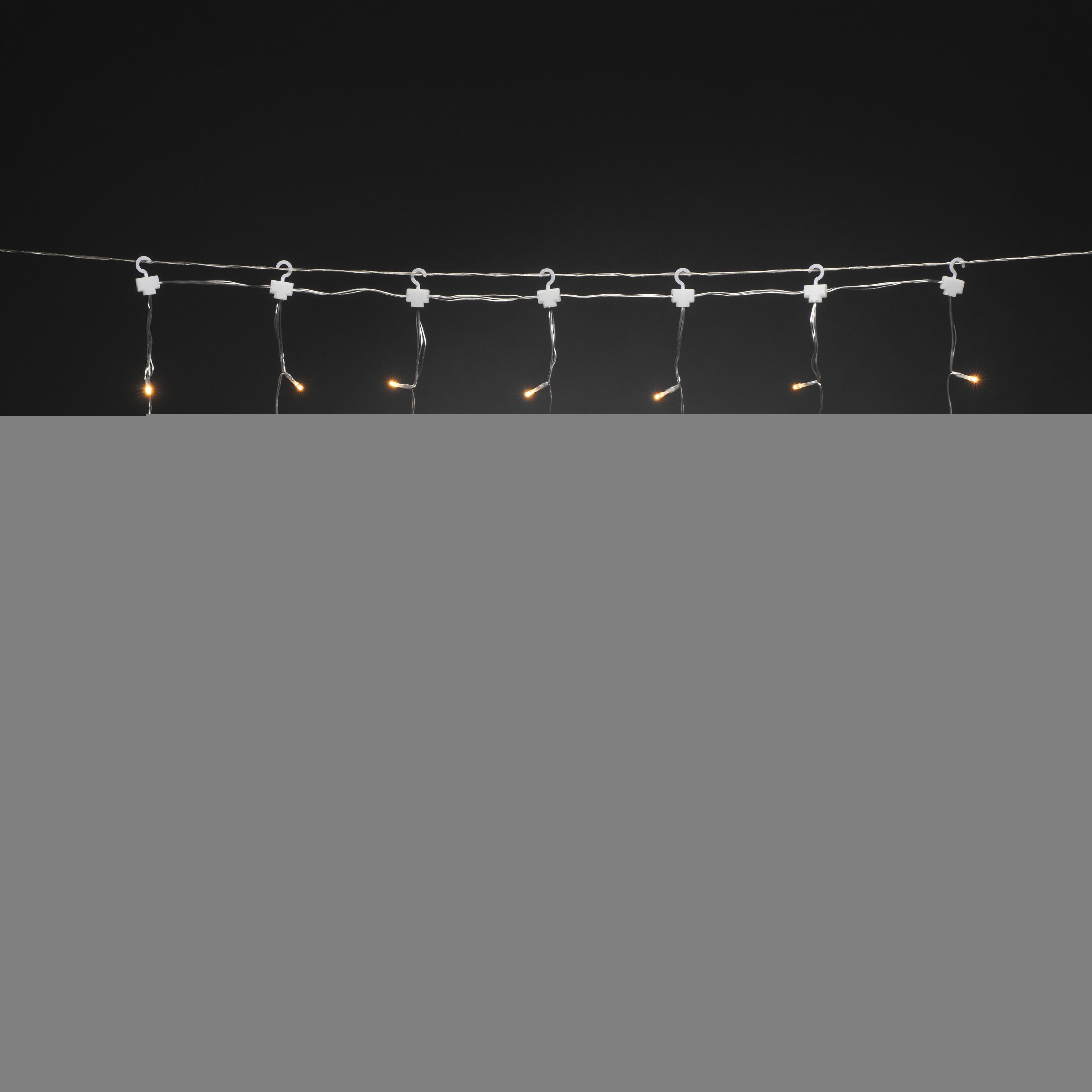 KONSTSMIDE Led-lichtgordijn 3 kleine en 4 grote sterren, met multifunctie, 77 amberkl. dioden (1 stuk)