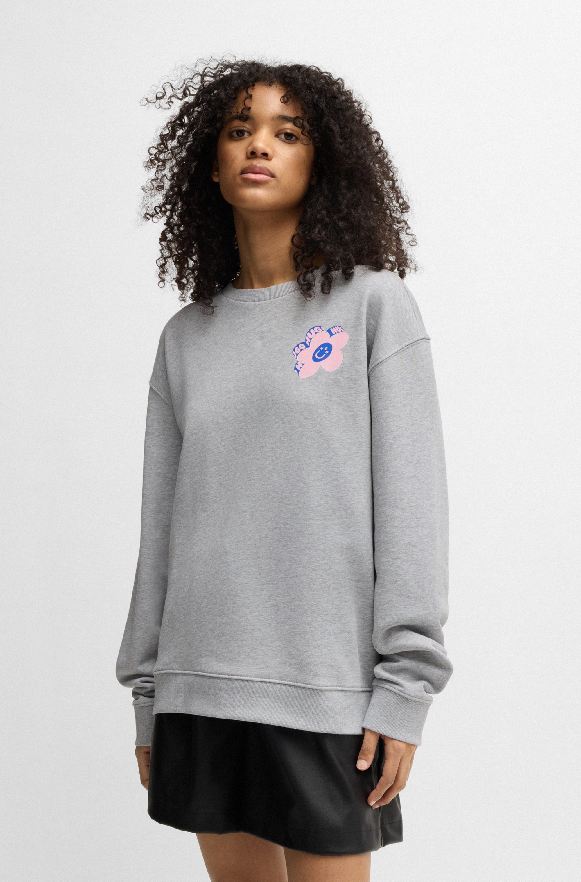 HUGO Blue Sweatshirt Oversized crew met bloemenprint op de achterkant, straß logo print