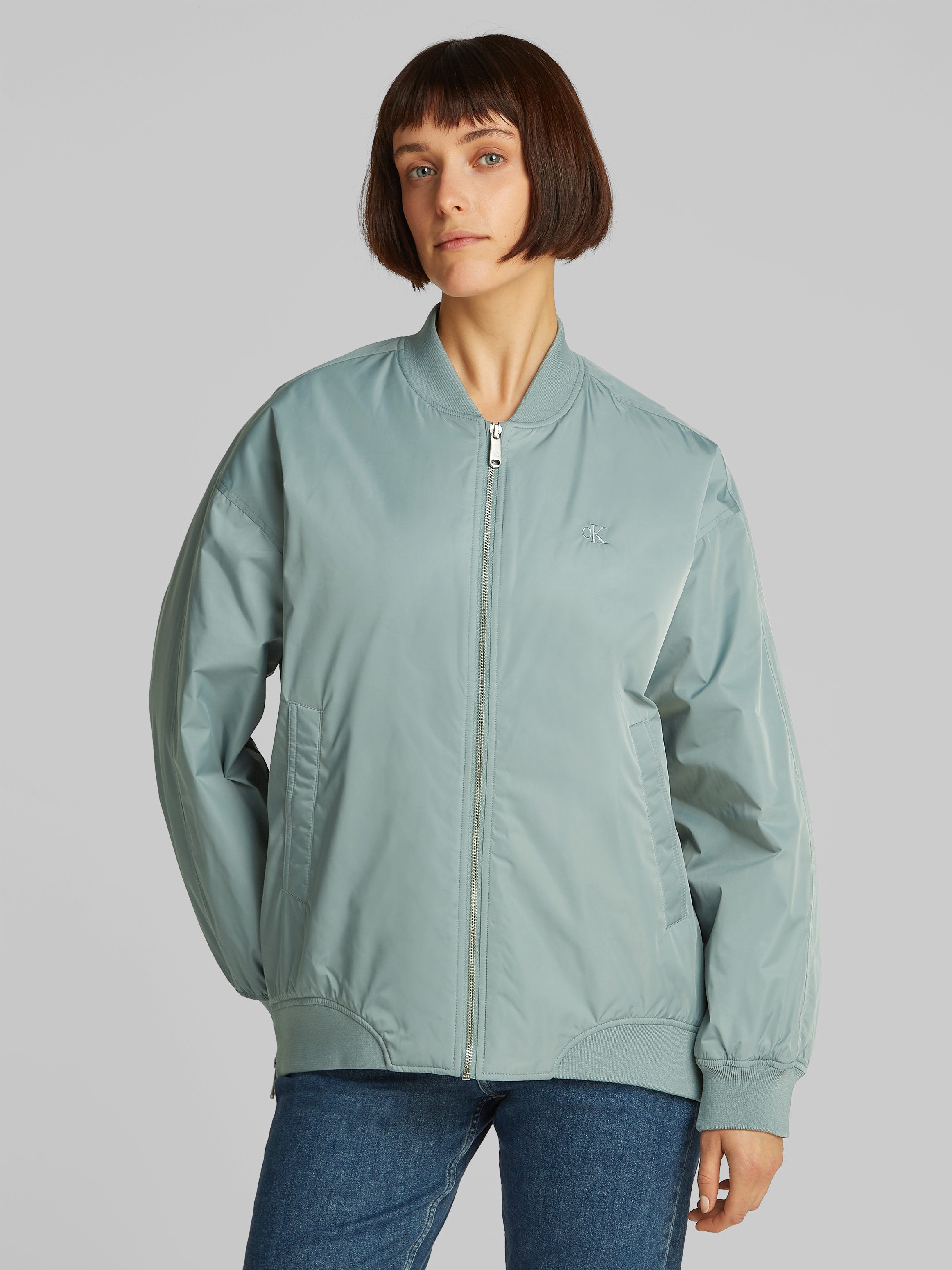 Calvin Klein Bomberjack LONG BOMBER met logo-opdruk, tailleafsluiting versmald door elastiek dames blousons maat XL (42) grijs
