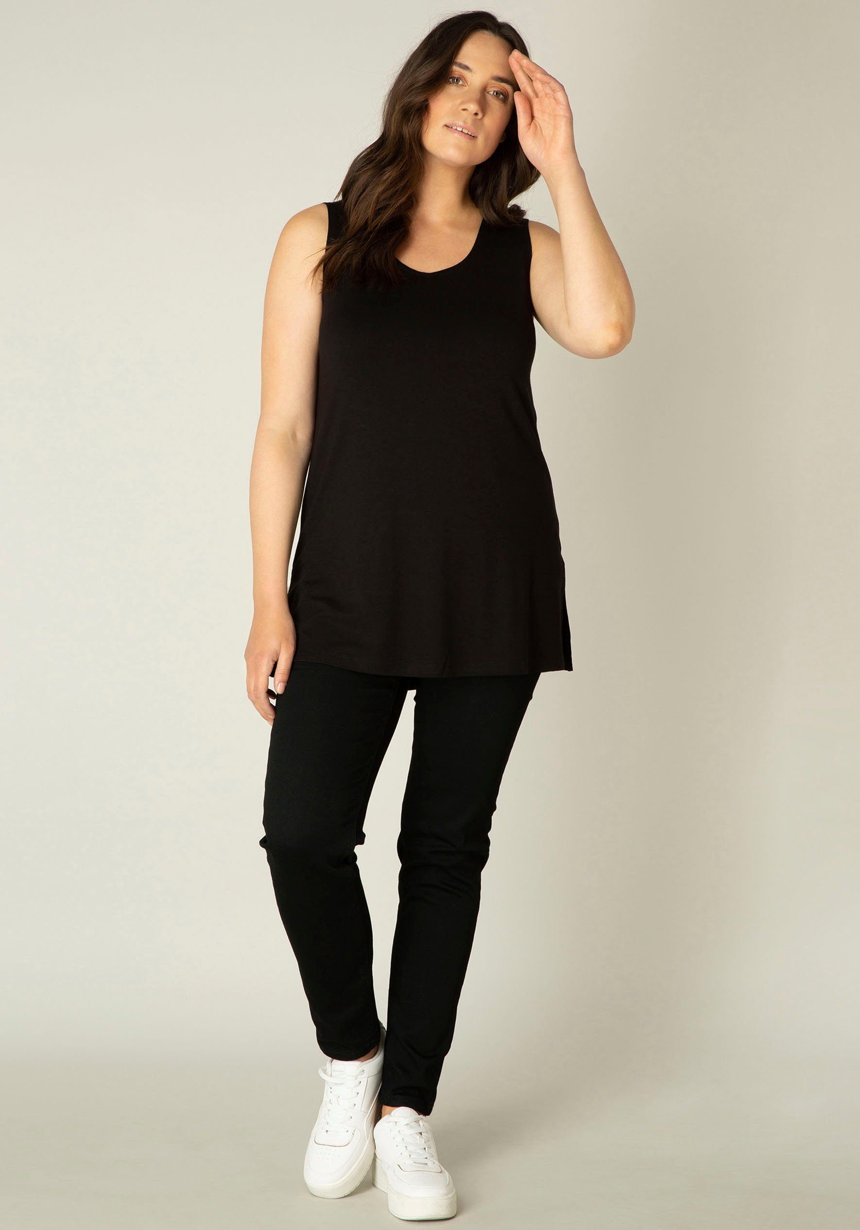 Base Level Curvy Top Over de heupen vallend model met splitjes bij de zoom