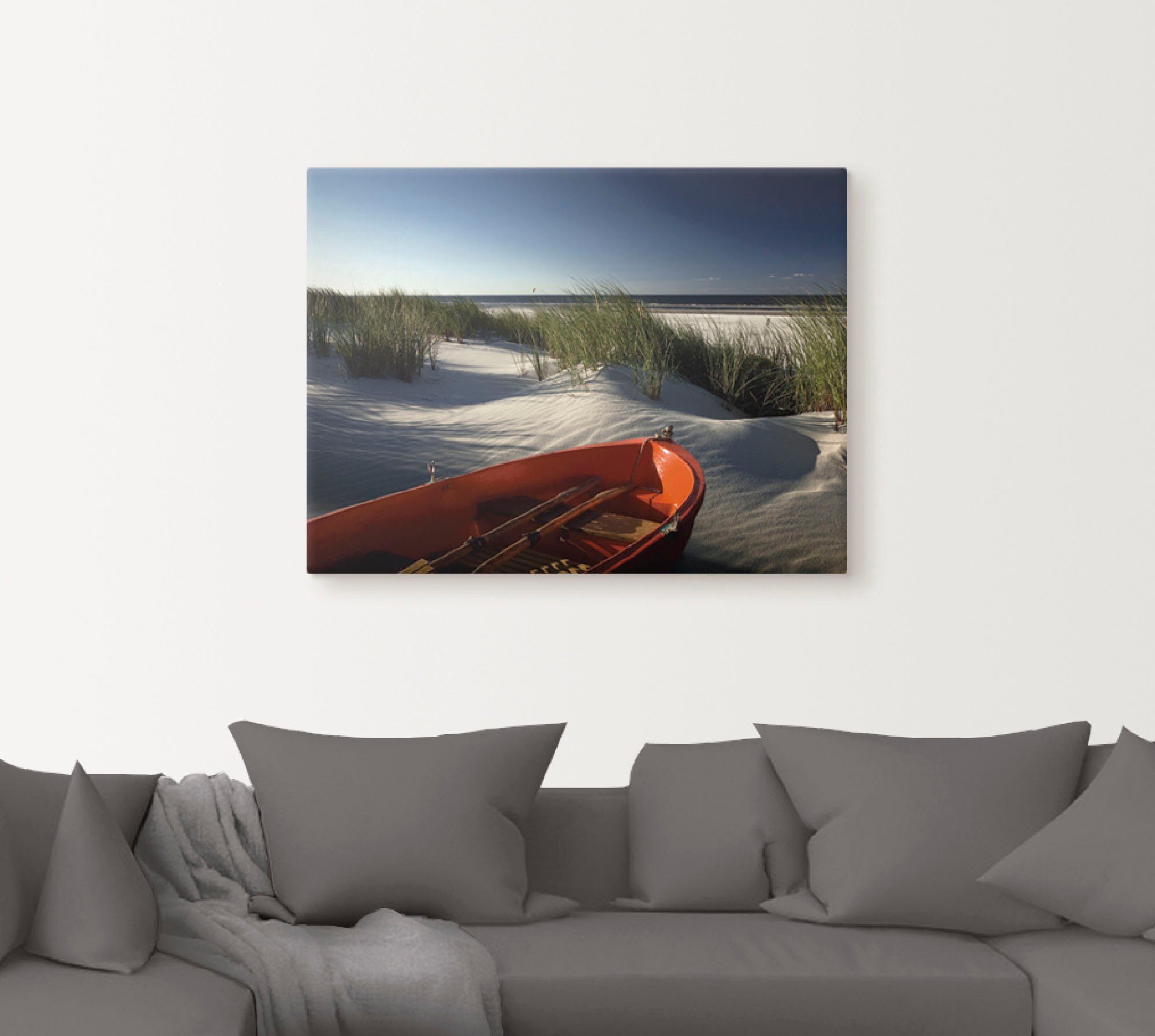 Artland Artprint op linnen Rode boot op het strand...
