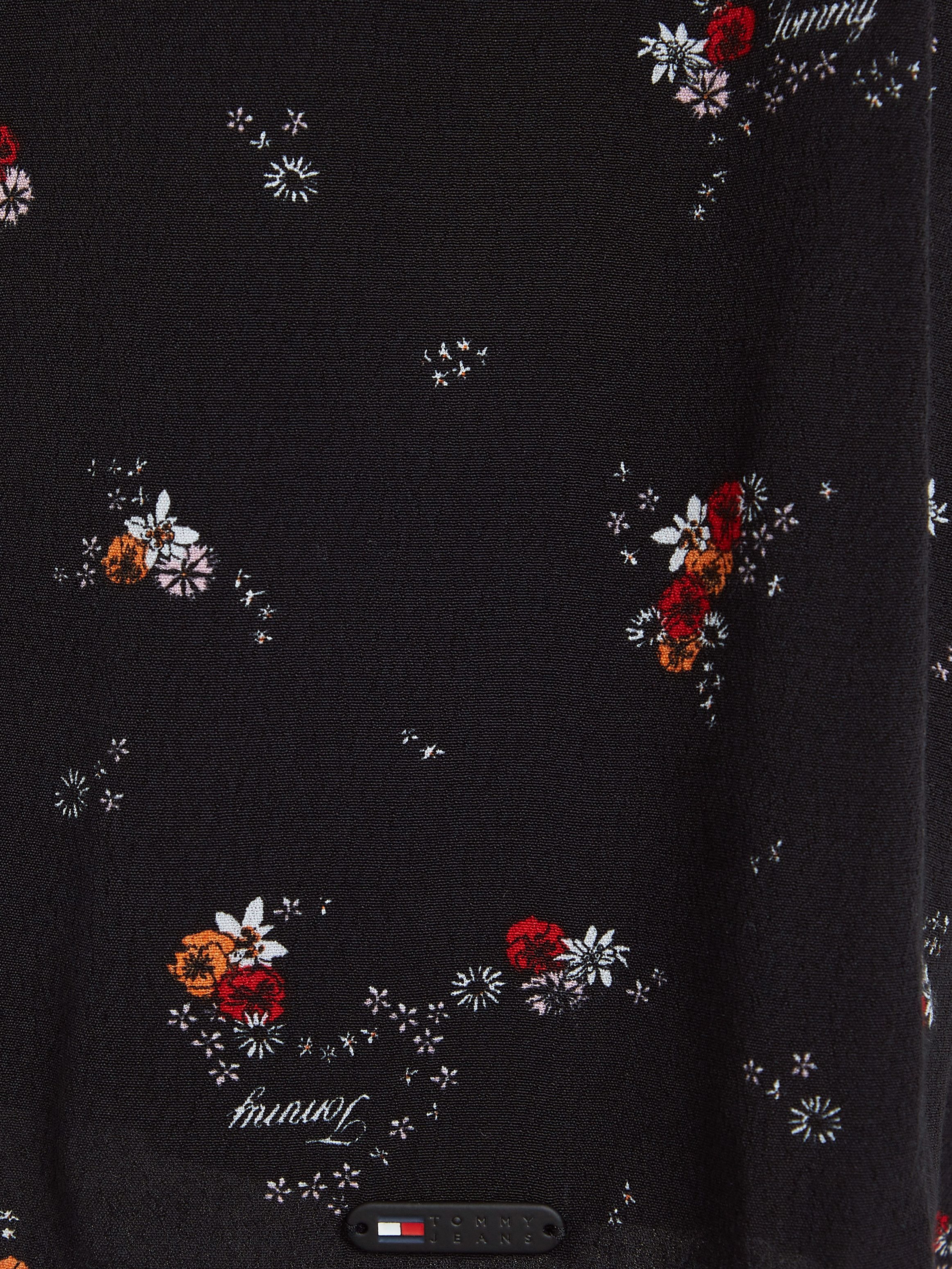 TOMMY JEANS Blousejurk TJW BLACK FLORAL RACER DRESS met bloemenprint modieuze racer vorm