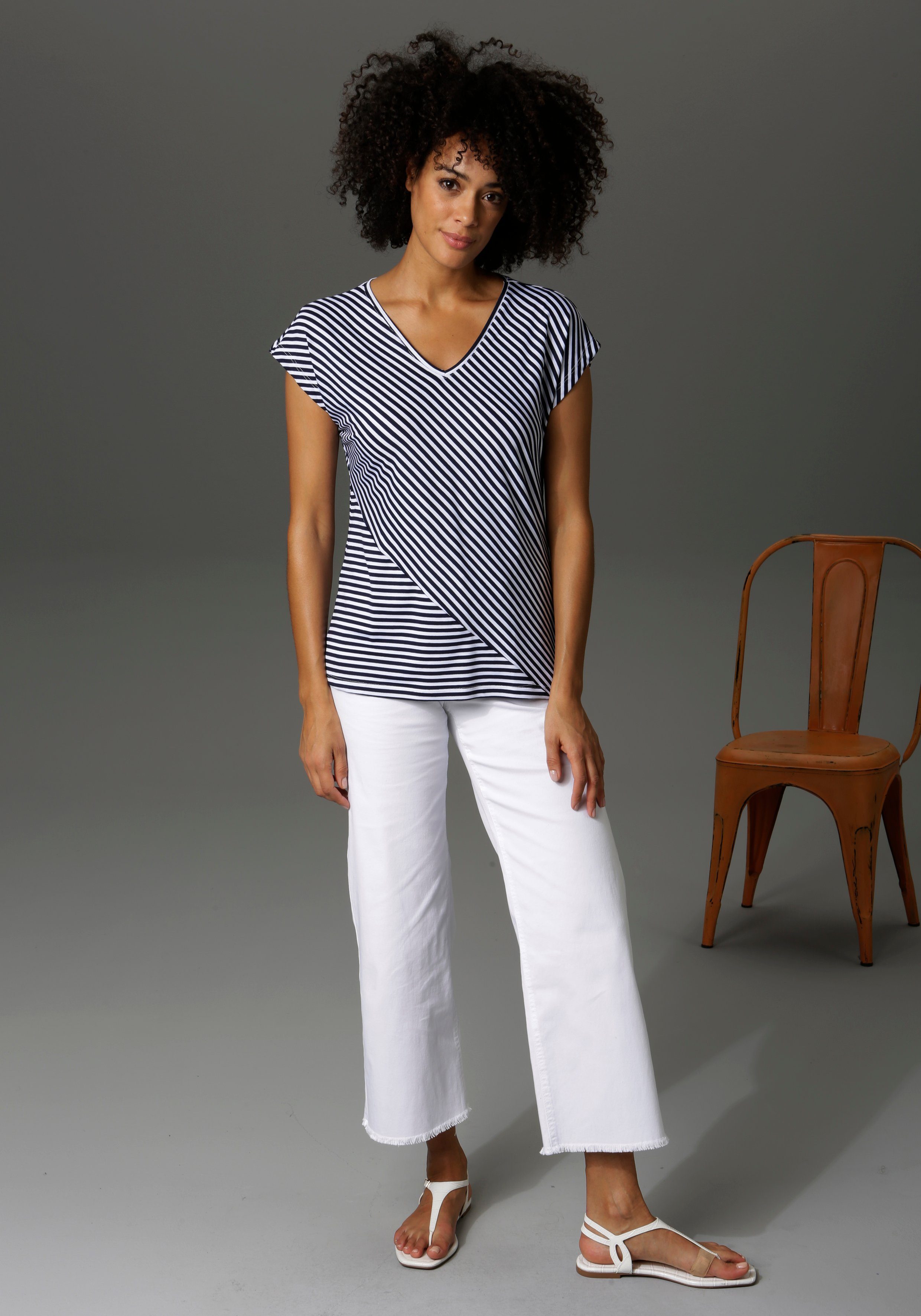 Aniston CASUAL 7/8 jeans met iets gerafelde voetzoom