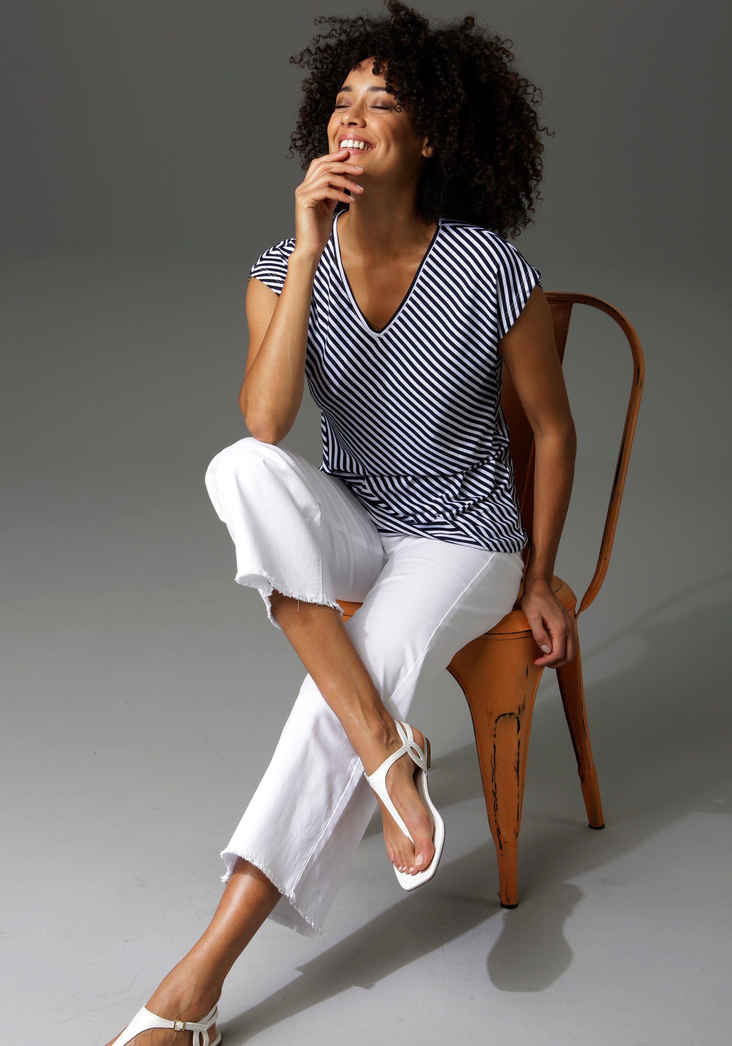 Aniston CASUAL 7/8 jeans met iets gerafelde voetzoom