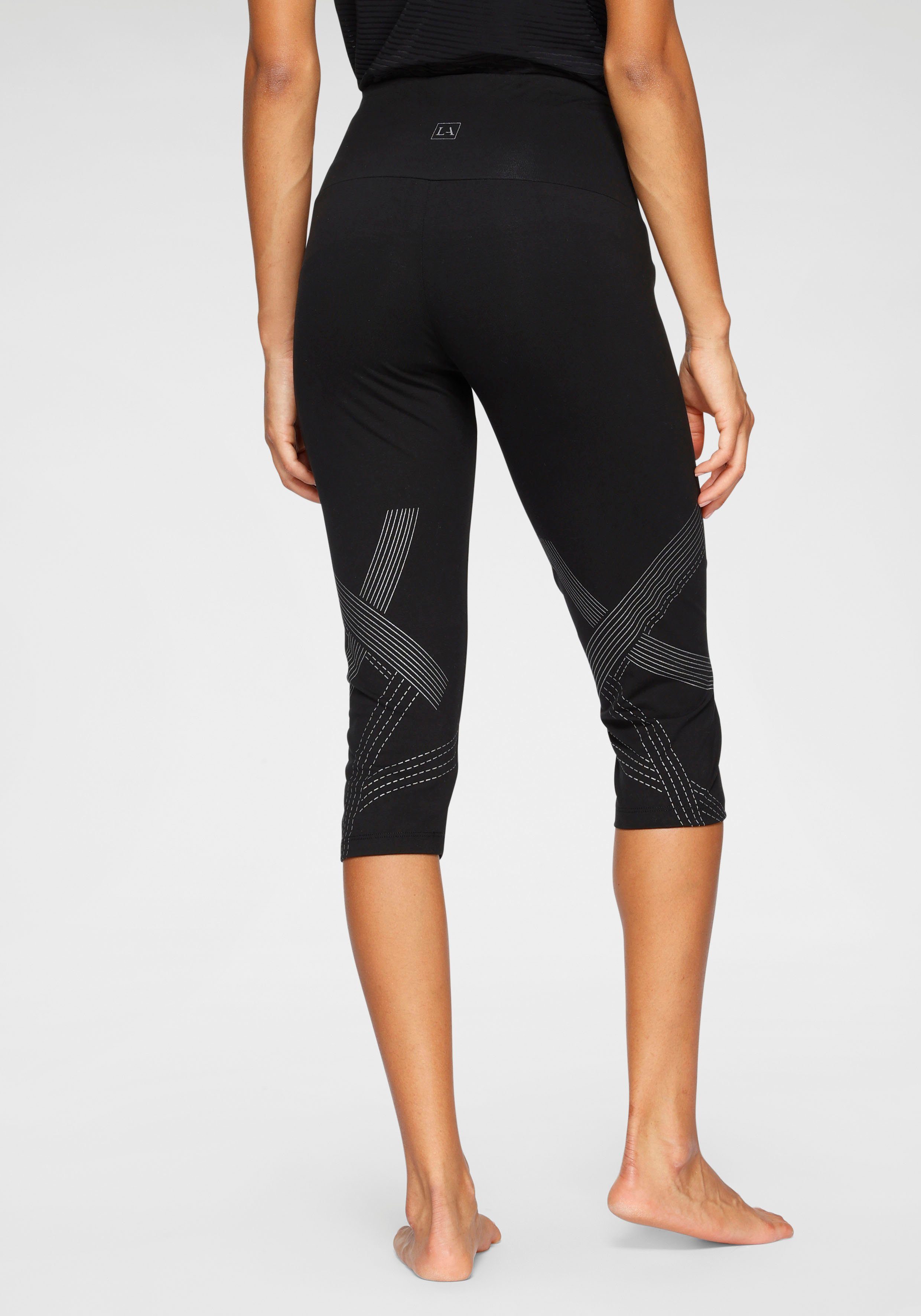 active by Lascana Caprilegging met optisch reflecterende print en tasje voor de mobiele telefoon